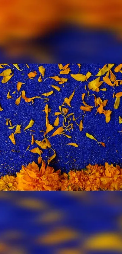 Vibrant blue wallpaper with scattered orange petals.