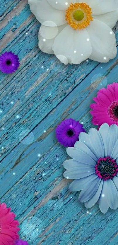 Colorful flowers on a blue rustic background wallpaper.