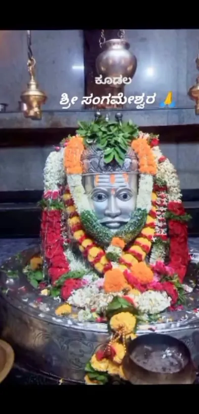 Colorful shrine adorned with vibrant flowers.