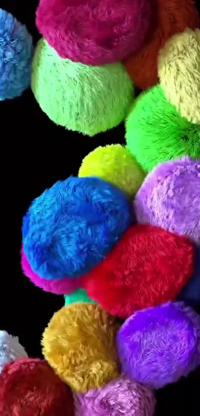 Vibrant and fluffy multicolor balls on black background.