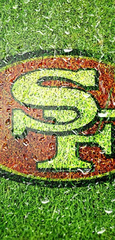 Football field with vibrant logo on grass.