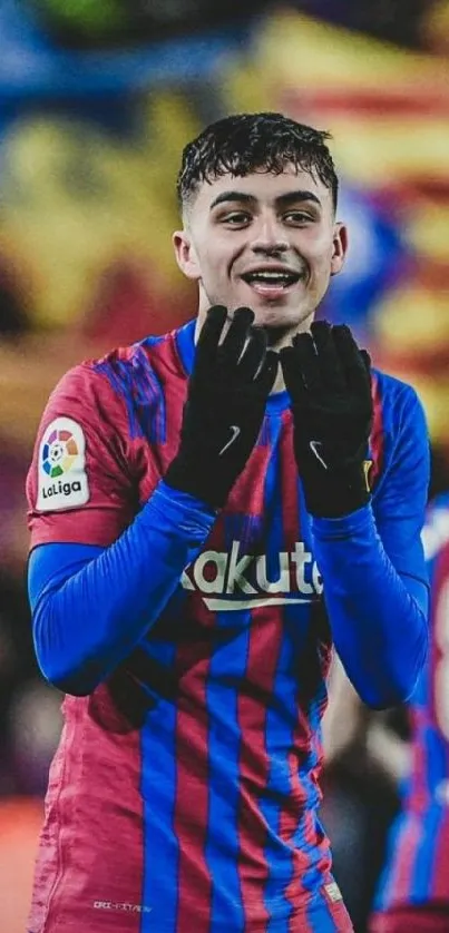 Vibrant football player in red and blue attire for mobile wallpaper.