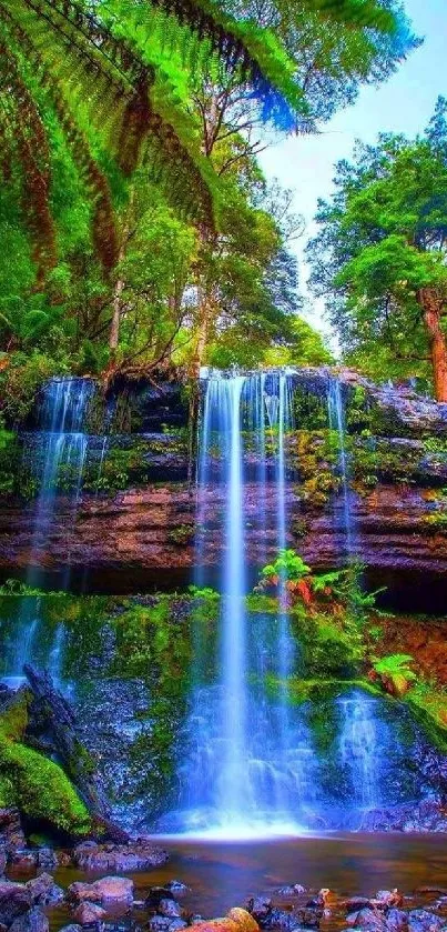 Vibrant forest waterfall with lush greenery.