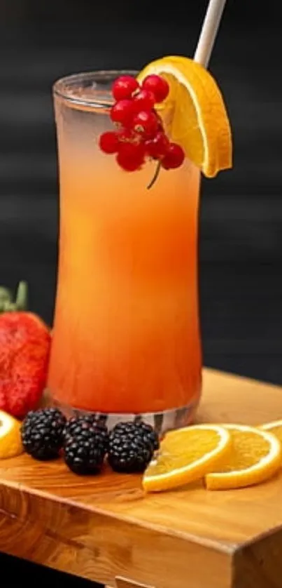 Vibrant fruit juice with orange slices and berries on wooden surface.