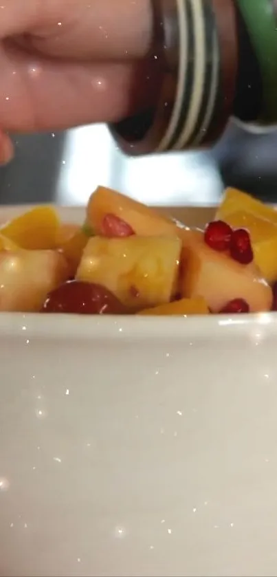 Fresh and colorful fruit salad in a white bowl.