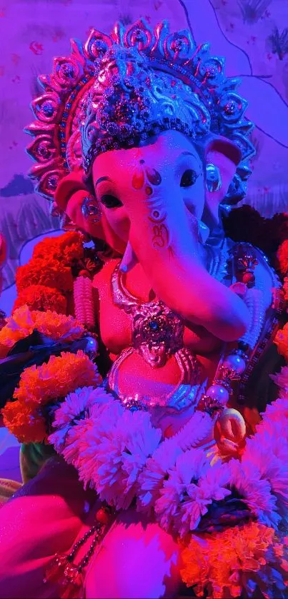 Colorful Ganesh statue with vibrant flowers.