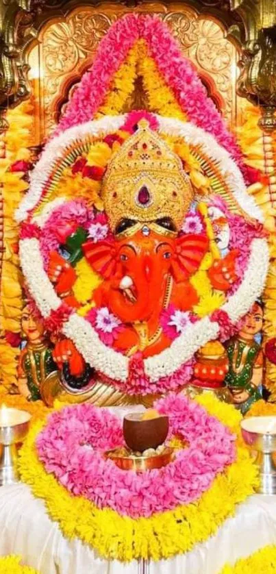 Colorful Ganesh festival mobile wallpaper with floral decorations.