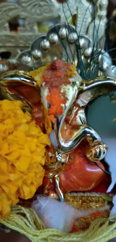 Colorful Ganesh idol with marigolds in vibrant festival setting.