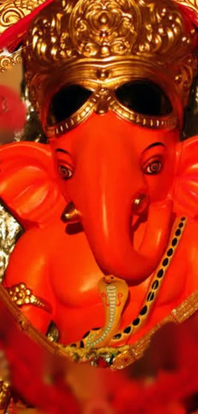 Vibrant orange Lord Ganesha with golden crown.