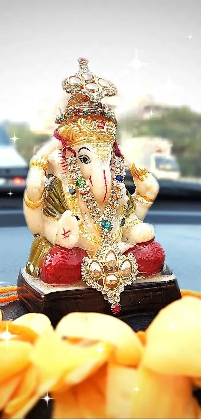 Vibrant Ganesha idol on car dashboard, adorned with jewels.