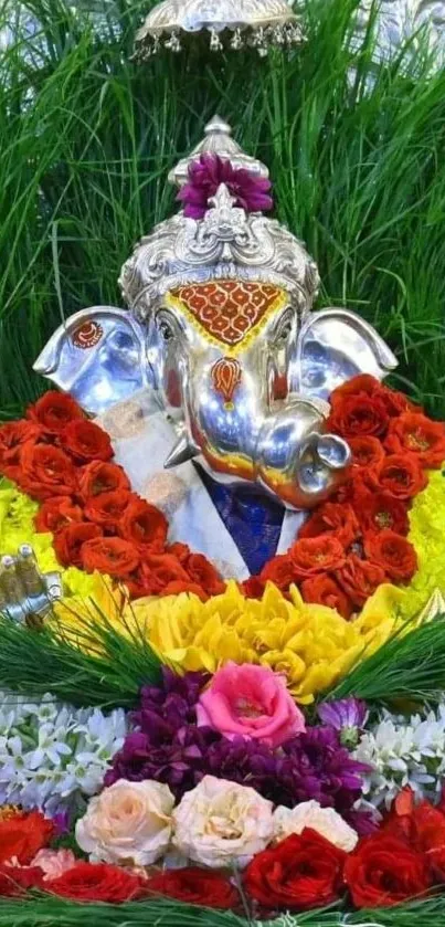 Vibrant Ganesha surrounded by colorful flowers and lush greenery.