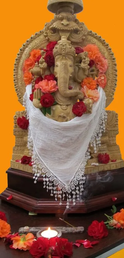 Mobile wallpaper featuring a golden Ganesha adorned with colorful flowers.