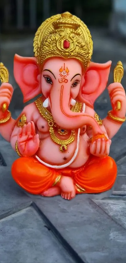 Vibrant Lord Ganesha statue on a mobile wallpaper.