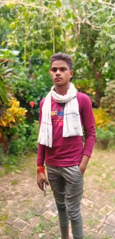 Young man in a vibrant garden background.