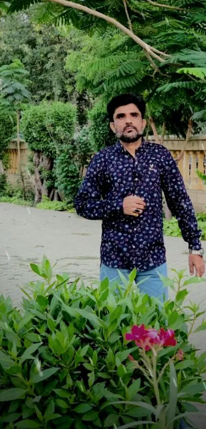 Man strolling in a lush garden with vibrant green plants.