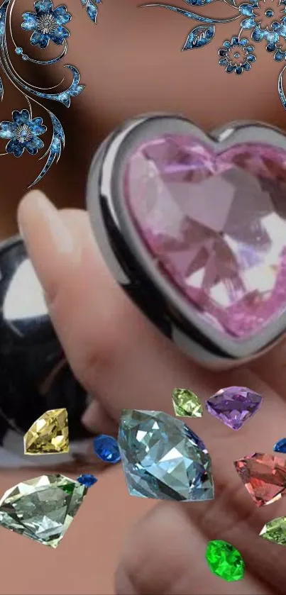 Heart-shaped pink gem with colorful floral designs and gemstones.