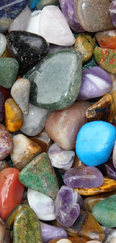 Vibrant collection of polished colorful gemstones on a phone wallpaper background.