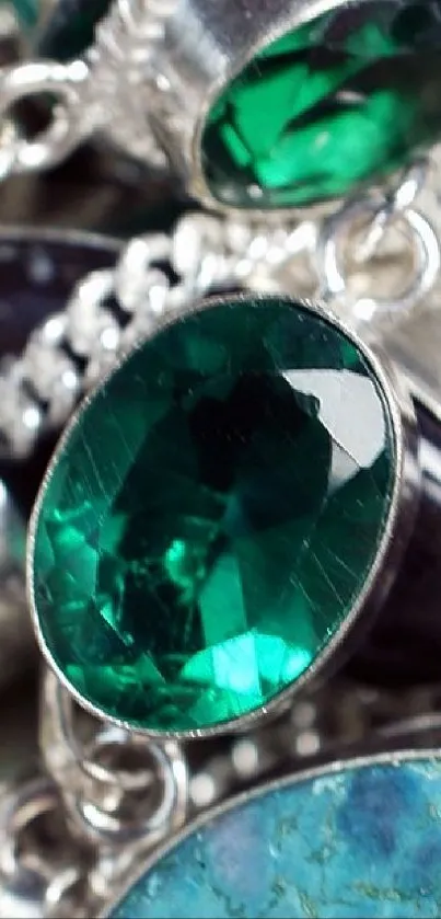 Close-up of vibrant gemstone jewelry in silver settings.
