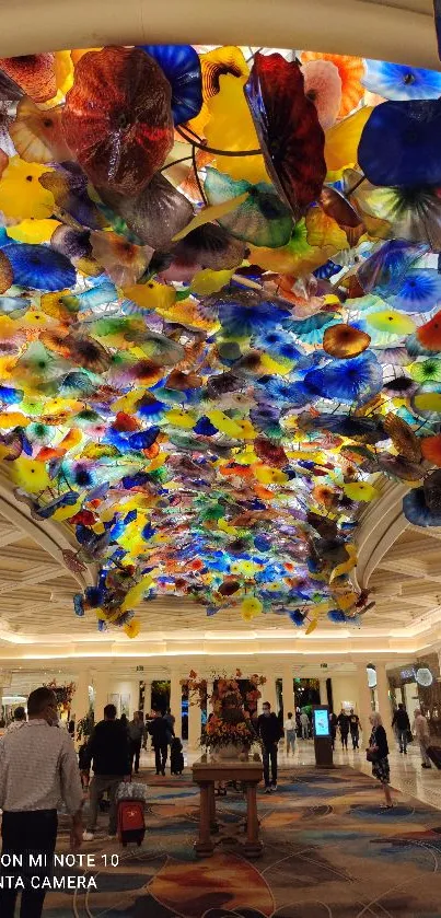 Colorful and intricate glass ceiling with vivid patterns in a luxury setting.