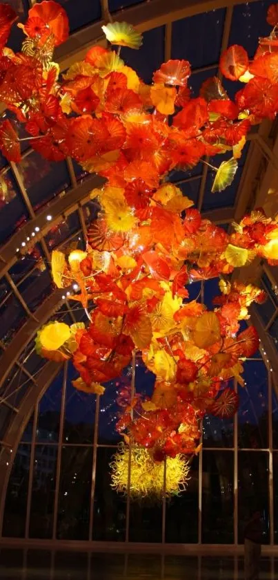 Stunning glass floral display with vibrant orange and yellow hues.