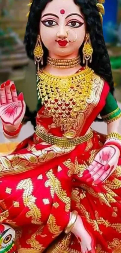 Vibrant goddess in red dress, traditional attire, with gold jewelry.