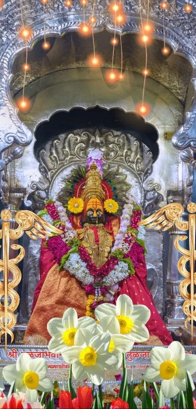 Vibrant decorated goddess in temple with colorful floral arrangement.