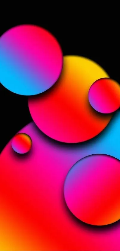 Vibrant gradient circles on black background wallpaper.