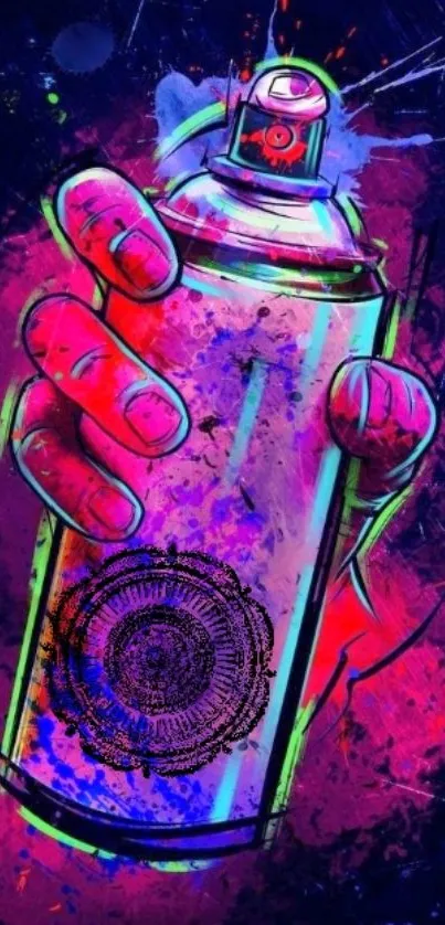 Hand holding spray can with graffiti style art on a dark background.