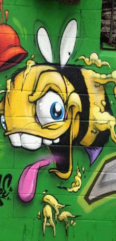 Vibrant graffiti of cartoon bee on green wall.