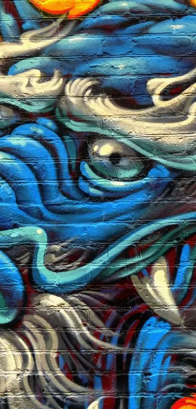 Vibrant blue graffiti dragon with fiery accents on a textured wall.