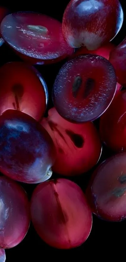 Sliced grapes on a black background wallpaper.