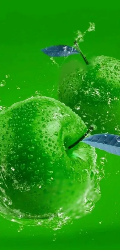 Two vibrant green apples splashing with water on a lush background.