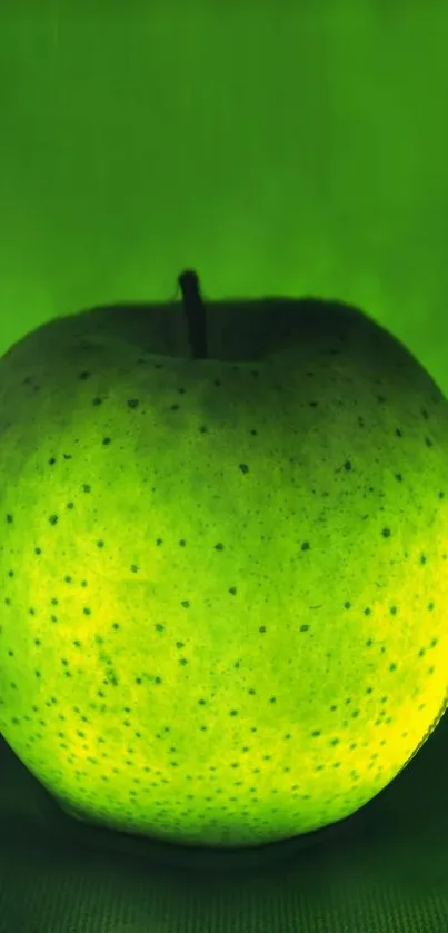 Vibrant green apple on a lush background wallpaper.