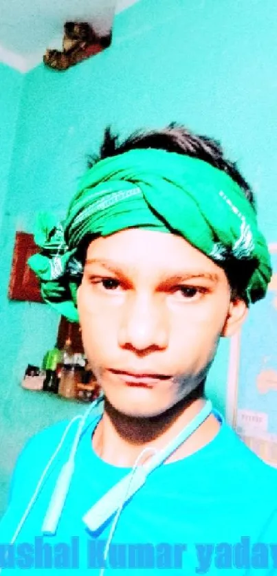 Portrait with green bandana and turquoise background.