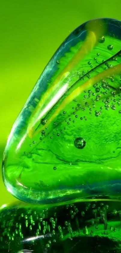 Vibrant green crystal glass art with intricate bubble details.