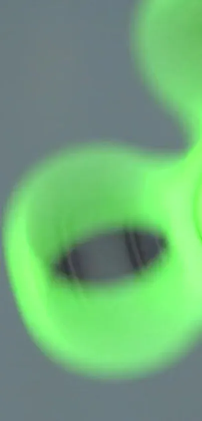 Close-up of a vibrant green fidget spinner in motion.