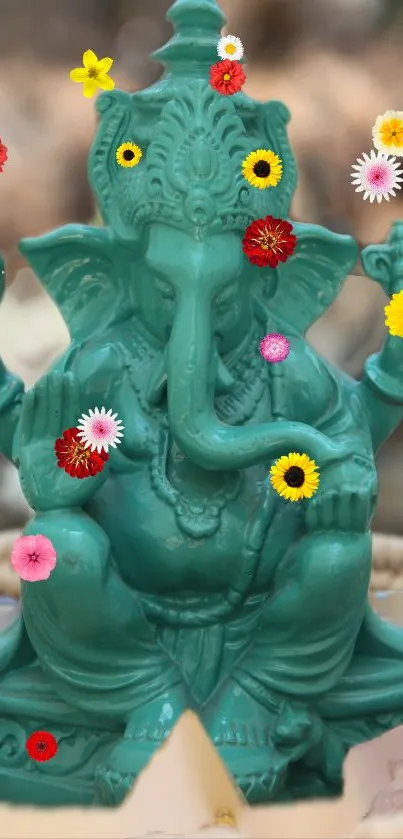 Jade green Ganesha statue with colorful flowers.