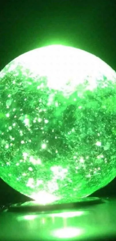 Vivid green glowing orb on a dark backdrop.