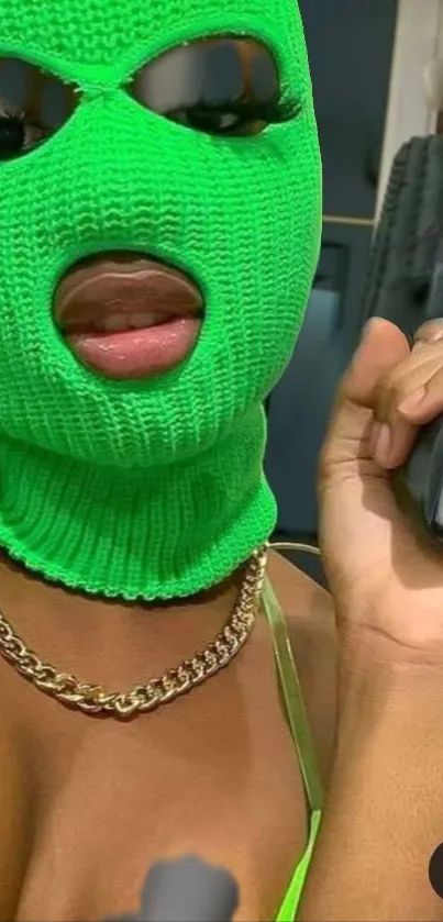 Portrait with bright green ski mask and chain necklace accessorized.