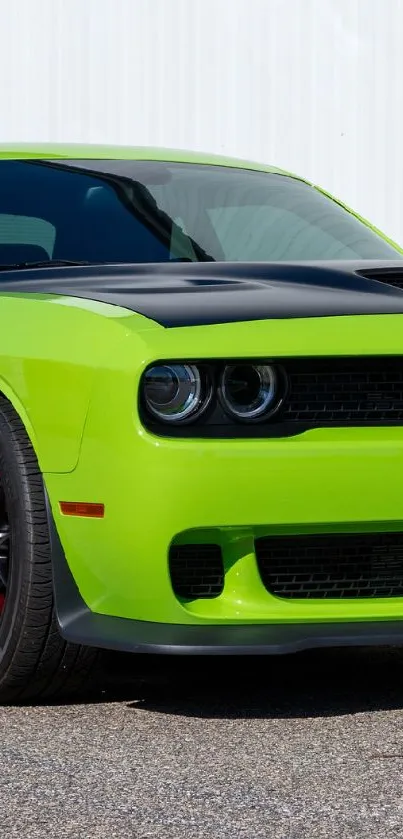 Lime green muscle car with sleek design parked on pavement.