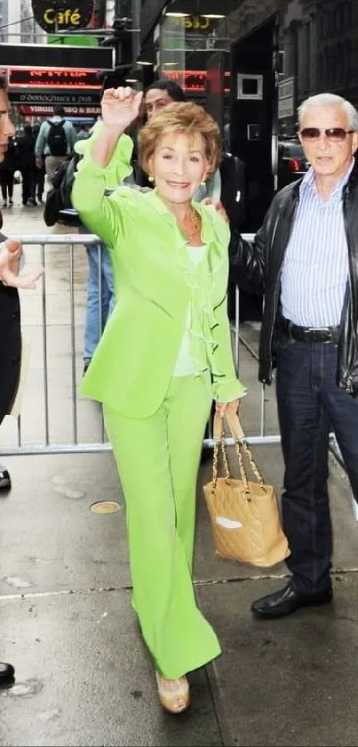 Person in lime green suit on a city street with others.