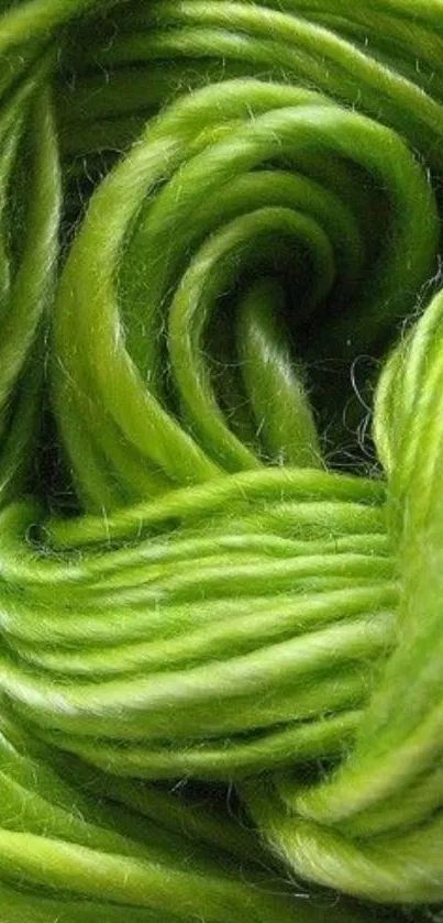 Close-up of vibrant green yarn strands wallpaper.