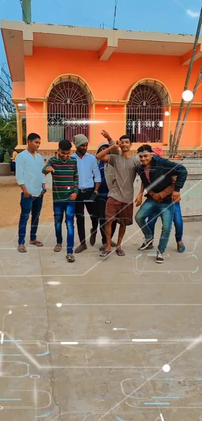 A group of friends posing outside a vibrant orange building.