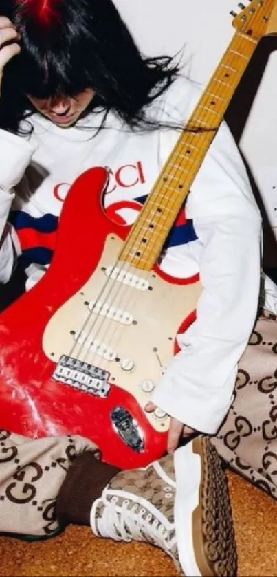 Woman with red guitar and stylish Gucci outfit.