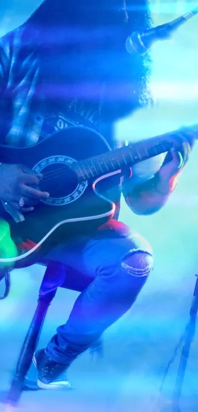 Musician playing guitar on stage, enveloped in blue lighting.