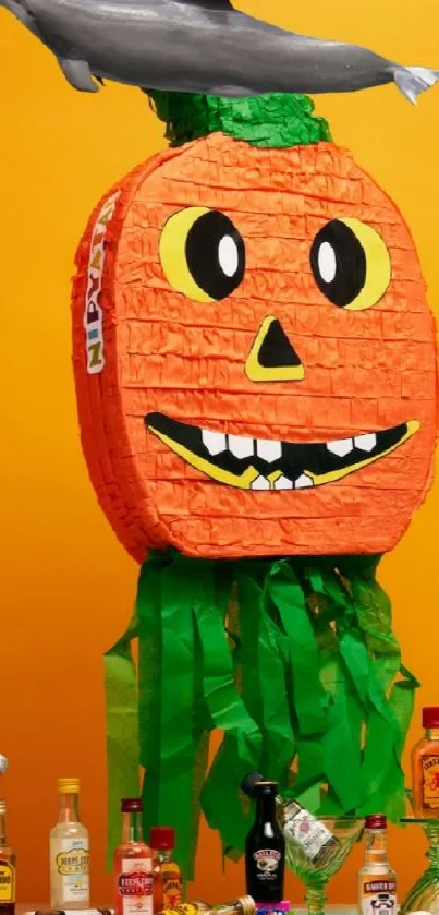 Bright pumpkin piñata with decorations against orange background.