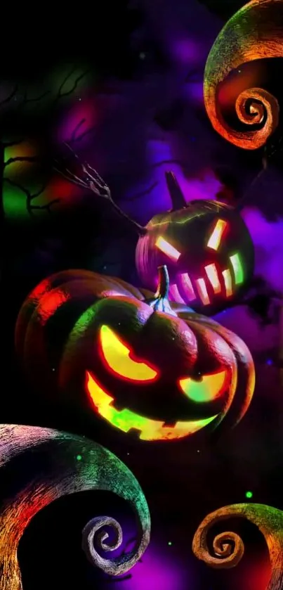 Colorful Halloween pumpkin wallpaper with glowing faces.