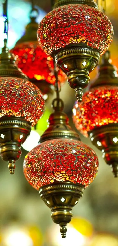 Vibrant glass lanterns with intricate patterns hanging decoratively.