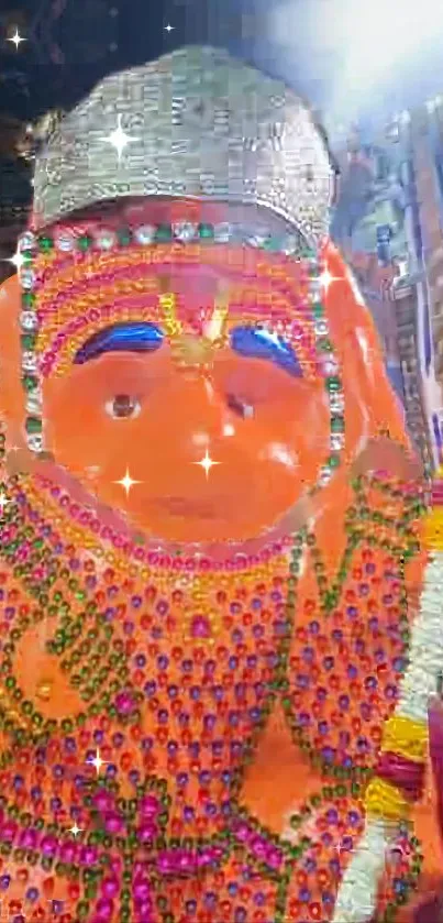 Vibrantly decorated Hanuman statue in orange hues.