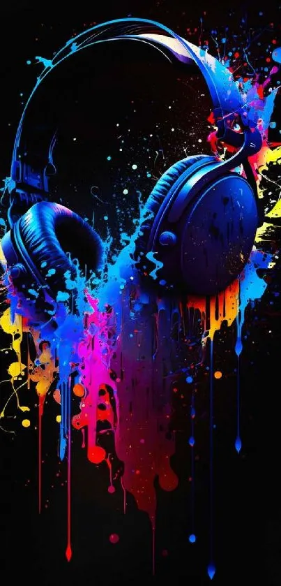 Colorful headphones with paint splashes on black background.